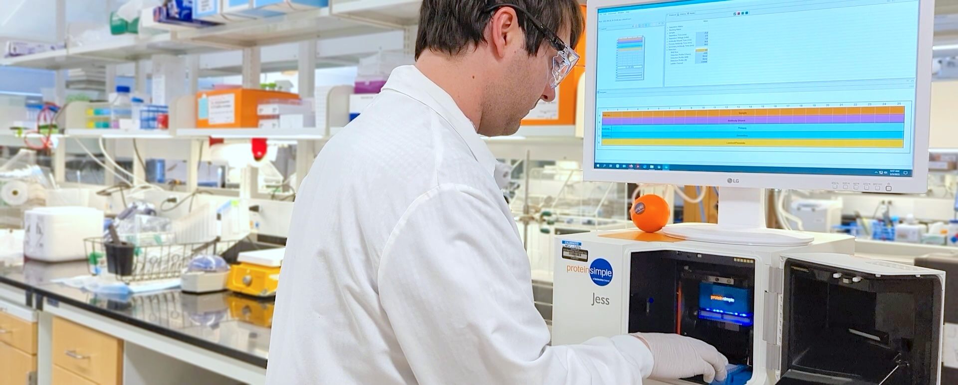 Banner image of a scientist using a Simple Western instrument